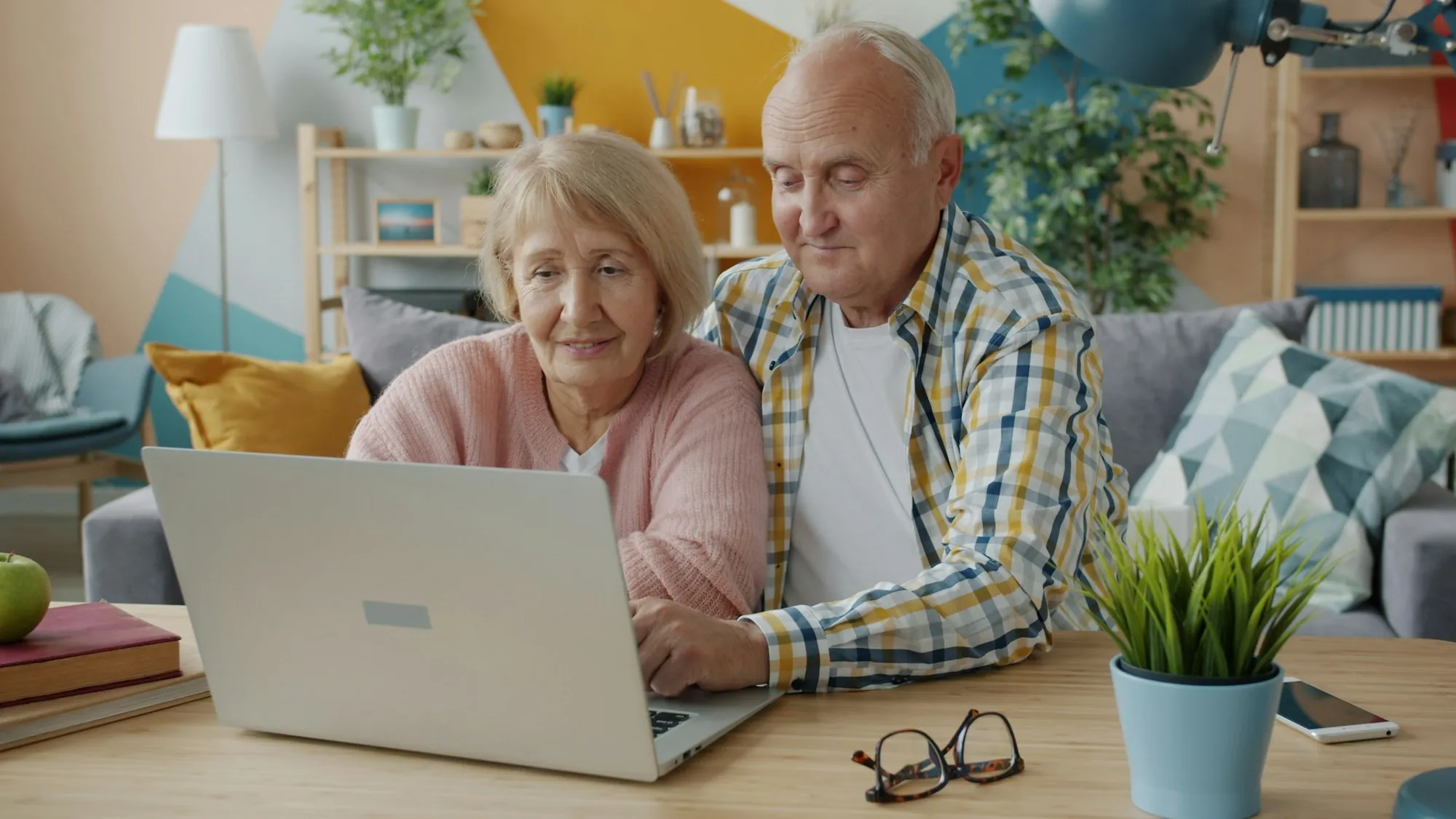 Senior couple using a laptop together